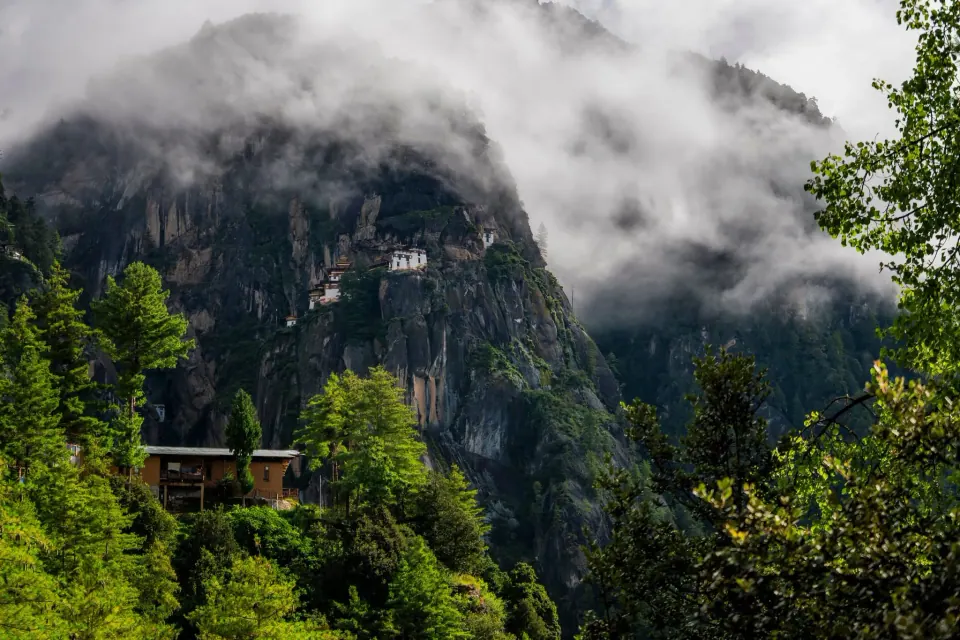 Tiger's Nest monastery appearing through mist above the Paro valley